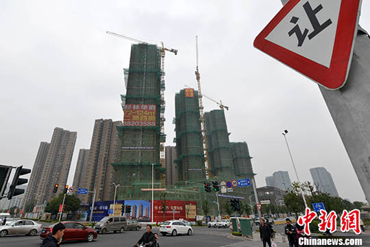資料圖：一處商品房在建中。 <a target='_blank' href='http://www.chinanews.com/'>中新社</a>記者 呂明 攝
