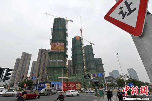 資料圖：商品房在建中。 <a target='_blank' href='http://www.chinanews.com/'>中新社</a>記者 呂明 攝