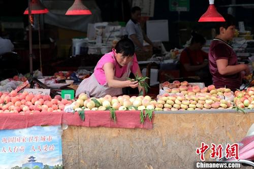 資料圖：菜市場商家。<a target='_blank' href='http://www.chinanews.com/'>中新社</a>記者 張遠(yuǎn) 攝